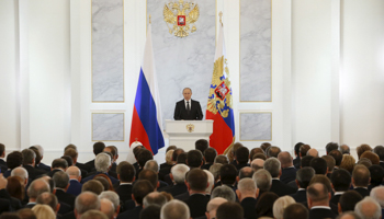 President Vladimir Putin addresses regional governors and other members of the Federal Assembly (Reuters/Sergei Karpukhin)