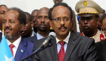 Somalia's newly-elected President Mohamed Abdullahi 'Farmajo' flanked by outgoing president Hassan Sheikh Mohamud, left, after winning the vote, Mogadishu, Somalia, February 2017  (Reuters/Feisal Omar)