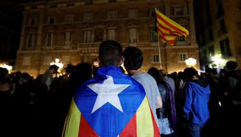 A man wears an Estelada, a Catalan separatist flag, in Barcelona, Spain (Reuters/Gonzalo Fuentes)