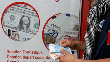 A currency dealer at a currency exchange point in Casablanca, Morocco (Reuters/Youssef Boudlal)