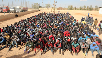 Migrants sit at a detention centre in Libya (Reuters/Hani Amara)