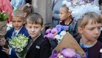 Schoolchildren attend a ceremony to mark the start of the school year in Kyiv (Reuters/Gleb Garanich)