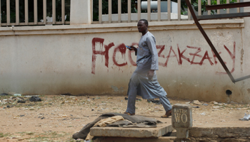 A man walks past graffiti saying “Free Zakzaky” in Kaduna (Reuters/Afolabi Sotunde)