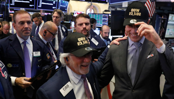 Thomas Farley, president of the New York Stock Exchange, and trader Peter Tuchman celebrate the DJIA rising above 23,500 (Reuters/Lucas Jackson)