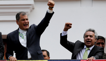 Correa, left, and Moreno greet supporters from the government palace's balcony during a military change of guard ceremony in Quito, Ecuador April 3, 2017 (Reuters/Mariana Bazo)