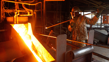 An employee at a platinum smelter near Harare, Zimbabwe, 2013 (Reuters/Philimon Bulawayo)