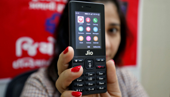 A salesperson displaying the JioPhone (Reuters/Amit Dave)