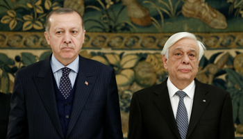 Turkish President Recep Tayyip Erdogan, left, and Greek President Prokopis Pavlopoulos at a state dinner at the Presidential Palace in Athens, December 7 (Reuters/Costas Baltas)