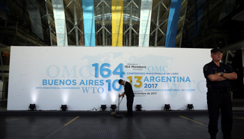 A man sweeping the floor at the WTO meeting in Buenos Aires (Reuters/Marcos Brindicci)