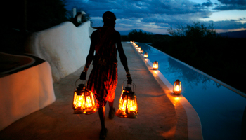 A Maasai waiter at little Shompole, a luxury eco-tourism lodge situated south of Nairobi, near the border with Tanzania (Reuters/Radu Sigheti)