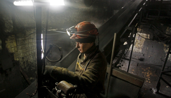 A worker controls the loading of coal at the Kalinin coal mine in Donetsk, Ukraine (Reuters/Alexander Ermochenko)