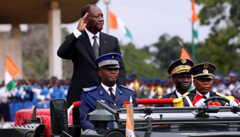 Ivory Coast's President Alassane Ouattara salutes during an independence day parade (Reuters/Luc Gnago)