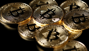 Bitcoin tokens (Reuters/Benoit Tessier/Illustration)