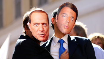 Five Star Movement supporters wear masks depicting former Italian Prime Ministers Silvio Berlusconi, left, and Matteo Renzi during a protest in front of Montecitorio government palace in Rome, Italy, October 11, 2017 (Reuters/Alessandro Bianchi)