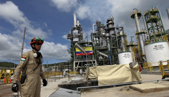 Oil workers at a refurbished oil refinery in Esmeraldas, Ecuador (Reuters/Guillermo Granja)