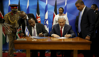 Kenya's President Uhuru Kenyatta, left and seated, and Israeli Prime Minister Benjamin Netanyahu, right and seated, in Jerusalem in 2016 (Reuters/Amir Cohen)