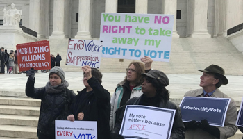 Activists rally outside the US Supreme Court ahead of arguments in a key voting rights case involving a challenge to Ohio's policy of purging infrequent voters from voter registration rolls, Washington, US, January 10, 2018 (Reuters/Lawrence Hurley)