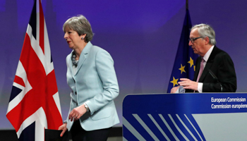 UK Prime Minister Theresa May and European Commission President Jean-Claude Juncker leave after a news conference at the EC headquarters in Brussels, Belgium, December 8, 2017 (Reuters/Yves Herman)