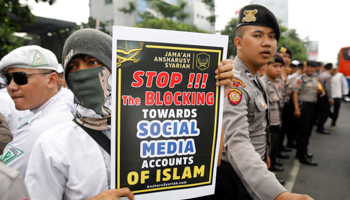 Muslim protesters rally outside the local Facebook office over the social media giant's blocking of some sites, in Jakarta, Indonesia (Reuters/Darren Whiteside)