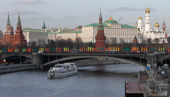 A vessel sails along the Moskva River with the Kremlin seen in the background (Reuters/Sergei Karpukhin)
