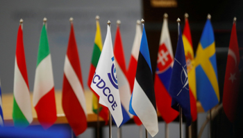 NATO Cooperative Cyber Defence Centre of Excellence, Estonian and  NATO flags are seen in front of member countries' flags at the centre premises in Tallinn, Estonia (Reuters/Ints Kalnins)