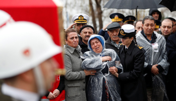 The mother of a Turkish soldier killed during Operation Olive Branch in Syrian Afrin is comforted at his funeral in Istanbul, February 11 (Reuters/Osman Orsal)