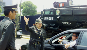 Police warden directs traffic in Peru (Reuters/Mariana Bazo)