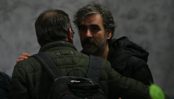 German-Turkish journalist Deniz Yucel hugs a well-wisher before boarding a plane taking him out of Turkey, February 16 (Reuters/Huseyin Aldemir)