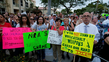 Protesters take part in a Call To Action Against Gun Violence rally by the Interfaith Justice League and others in Delray Beach, Florida, February 19, 2018 (Reuters/Joe Skipper)