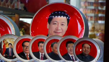 Souvenir plates featuring portraits of former and current Chinese leaders including President Xi Jinping at a shop in Beijing (Reuters/Jason Lee)