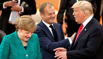 German Chancellor Angela Merkel talks with US President Donald Trump and European Council President Donald Tusk at the G20 leaders summit in Hamburg, Germany (Reuters/Ludovic Marin)