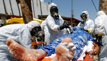 Syrian medical staff take part in a training exercise to learn how to treat victims of chemical weapons attacks, July 2017 (Reuters/Murad Sezer)