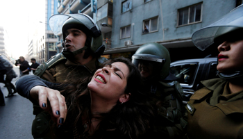 A Mapuche activist detained by police in Santiago (Reuters/Carlos Vera)