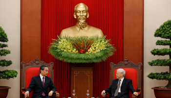 China's State Councilor and Foreign Minister Wang Yi, left, meets Vietnam's Communist Party General Secretary Nguyen Phu Trong at the Party's head office in Hanoi, Vietnam (Reuters/Kham)