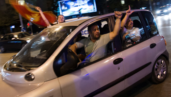Supporters of Milo Djukanovic, the presidential candidate of the ruling Democratic Party of Socialists, celebrate his victory in Podgorica, April 15 (Reuters/Stevo Vasiljevic)