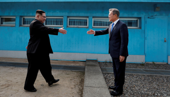 South Korean President Moon Jae-in and North Korean leader Kim Jong Un shake hands at the truce village of Panmunjom inside the demilitarized zone separating the two Koreas, South Korea, April 27 (Reuters/Korea Summit Press Pool)