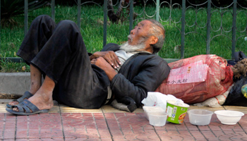 A man begs for food or money in central Beijing, 2009 (Reuters/David Gray)