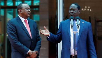 President Uhuru Kenyatta and opposition leader Raila Odinga speak to the press following their public reconciliation, March 9, 2018 (Reuters/Thomas Mukoya)