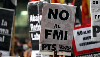 A protest outside the Argentine Congress, with a placard reading “No to the IMF” (Reuters/Marcos Brindicci)