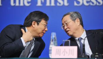 Recently retired People's Bank of China Governor Zhou Xiaochuan with his successor Yi Gang (Reuters/Stringer)