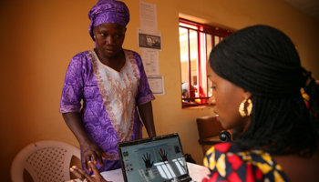 A woman has her fingerprints captured during voter card registration in Abuja (Reuters/Afolabi Sotunde)