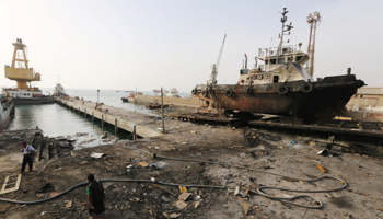 Workers inspect damage at the site of an air strike on the maintenance hub at the Hodeida port, Yemen, May 27 (Reuters/Abduljabbar Zeyad)