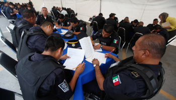 Policemen take psychometric evaluation tests at the Alamey police headquarters in Monterrey (Reuters/Tomas Bravo)