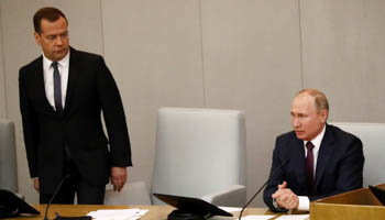 Russian Prime Minister Dmitry Medvedev (L) with President Vladimir Putin. (Reuters/Sergei Karpukhin)