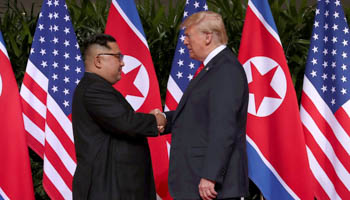 US President Donald Trump shakes hands with North Korean leader Kim Jong-un (Reuters/Jonathan Ernst)