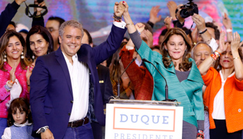 Colombia’s president elect Ivan Duque greets supporters alongside running mate Marta Lucia Ramirez (Reuters/Andres Stapff)