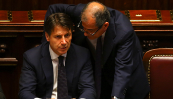 Italian Prime Minister Giuseppe Conte talks with Economy Minister Giovanni Tria (Reuters/Tony Gentile)