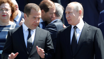 President Vladimir Putin (R) and Prime Minister Dmitry Medvedev (Reuters/Sergei Karpukhin)
