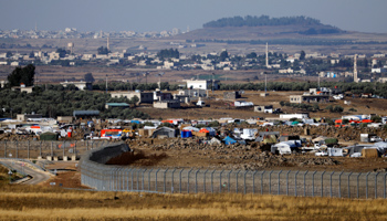 Refugee tents erected in Syria near the Israeli borderline seen from the Golan Heights, Israel (Reuters/Ronen Zvulun)