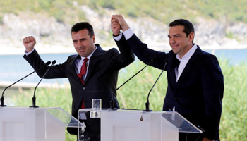 Greek and Macedonian premiers Alexis Tsipras and Zoran Zaev at signing of agreement to end name dispute, Prespes, Greece, June 17 (Reuters/Alkis Konstantinidis)